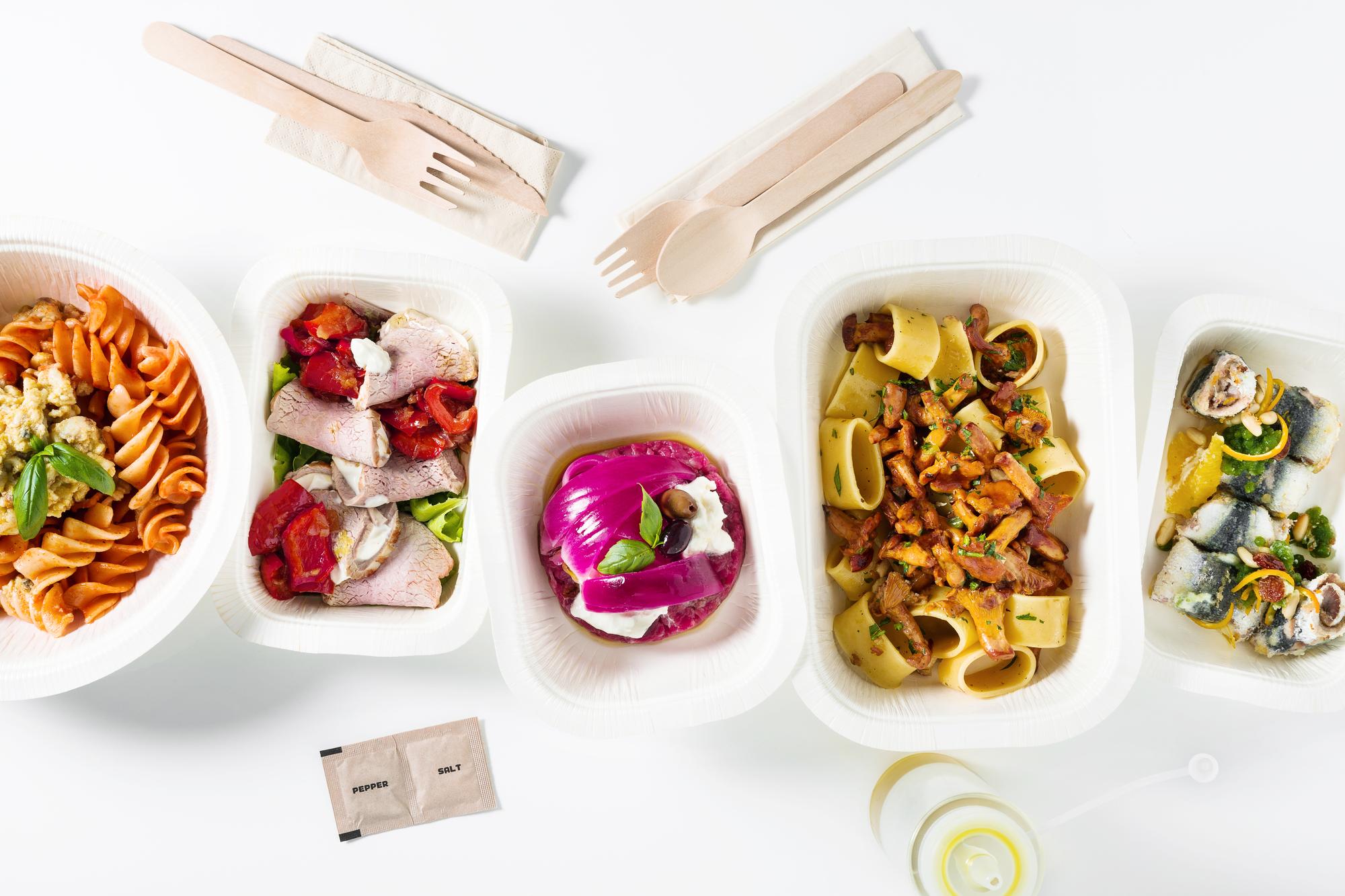 Flat-lay of colorful meal prep bowls